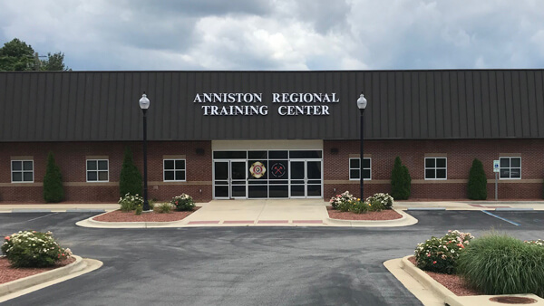 Exterior of Anniston RTC. Brick building with landscaping.